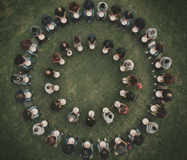 corporate group participating in drum circle