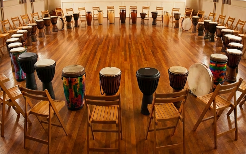 team drumming activity in conference room